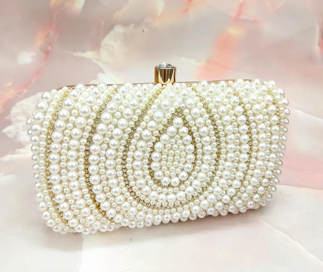 Pearl studded clutch bag